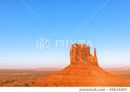 Beautiful sunset over famous Butte of Monument Valley on the border between Arizona and Utah, USA 69624869