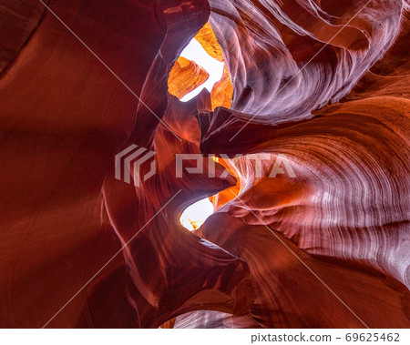 Beautiful view of amazing sandstone formations in famous Antelope Canyon Beautiful view of amazing sandstone formations in famous Antelope Canyon 69625462