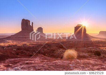 Beautiful sunrise view of famous Buttes of Monument Valley 69625529