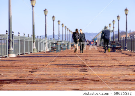 View  of historic wooden Pier 7. Famous San Francisco promenade. California, USA 69625582