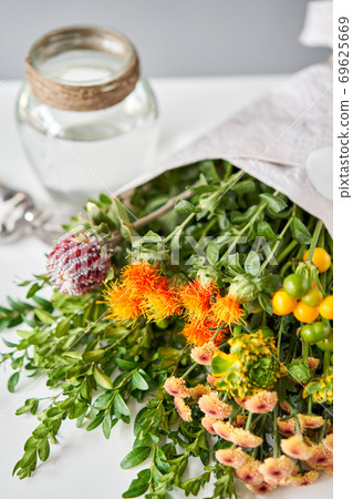 Series, step by step installation of flowers in a vase. Flowers bunch, set for home. Fresh cut flowers for decoration home. European floral shop. Delivery fresh cut flower. Series, step by step installation of flowers in a vase. Flowers bunch, set for home. Fresh cut flowers for decoration home. European floral shop. Delivery fresh cut flower. 69625669