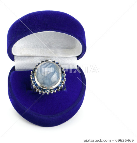 Ring with natural sapphires isolated on white background. Gems of Sri Lanka. Free space for text. 69626469