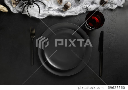 Halloween  table setting with spider, skull, web. 69627560
