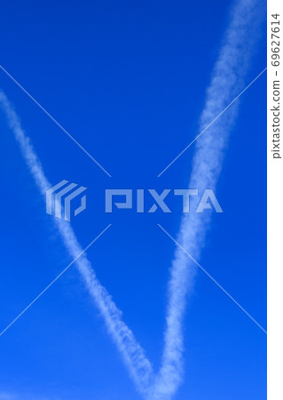 Blue sky with cirrus clouds in the form of an Okay sign. Beautiful background Blue sky with cirrus clouds in the form of an Okay sign. Beautiful background 69627614