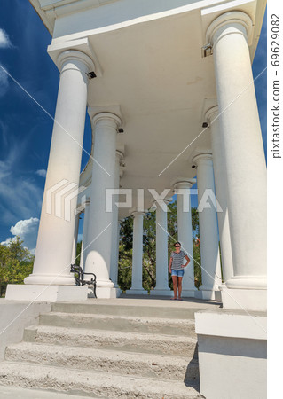 Colonnade in Chernomorsk city on a sunny summer day, Ukraine. 69629082