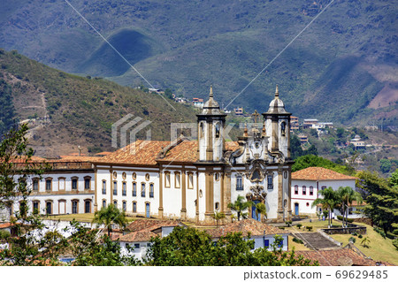 View of historic 18th century church in colonial architecture and hills 69629485