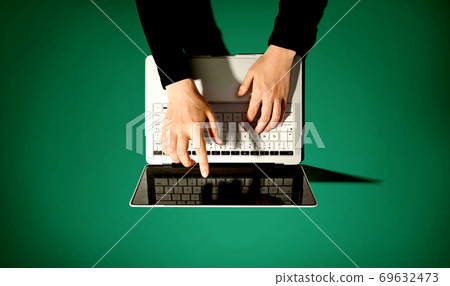 Person using a laptop computer 69632473