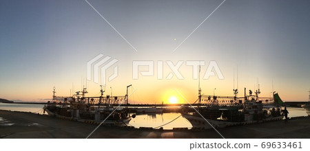 Dawn of fishing port where squid fishing boats berth Dawn of fishing port where squid fishing boats berth 69633461
