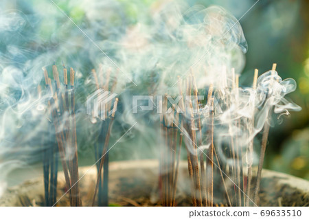 burning aromatic incense sticks. Incense for praying hindu and buddha 69633510