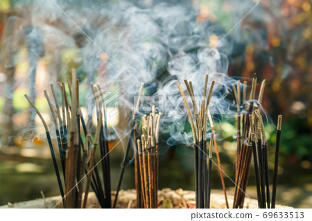 burning aromatic incense sticks. Incense for praying hindu and buddha burning aromatic incense sticks. Incense for praying hindu and buddha 69633513