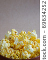 Popcorn in the Ceramic Bowl. 69634252
