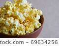 Popcorn in the Ceramic Bowl. 69634256