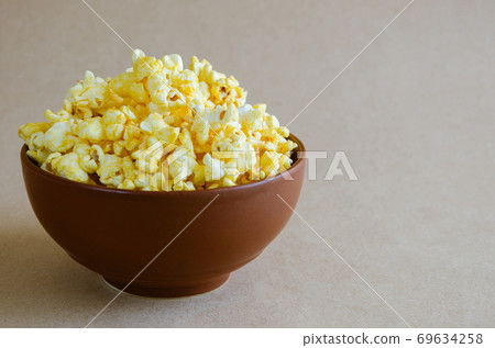 Popcorn in the Ceramic Bowl. Popcorn in the Ceramic Bowl. 69634258