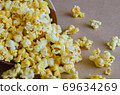 Caramel Popcorn is Spill Out of Bowl. 69634269