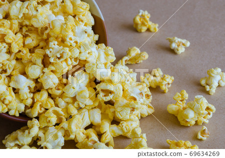 Caramel Popcorn is Spill Out of Bowl. Caramel Popcorn is Spill Out of Bowl. 69634269
