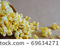 Caramel Popcorn is Spill Out of Bowl. 69634271