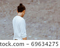 Man is Standing Turn Back Outdoor in Soft Focus Background. 69634275