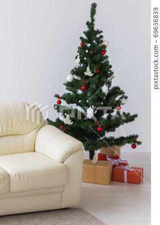 Holidays, celebration and home concept - living room with christmas tree and presents background. 69636839