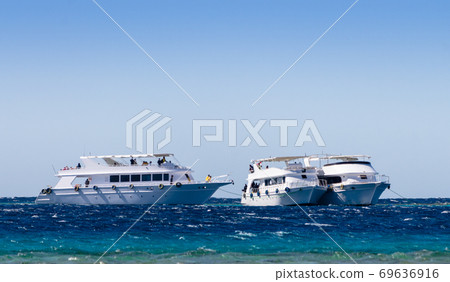 three white pleasure boat in the Red Sea in Egypt Dahab South Sinai 69636916
