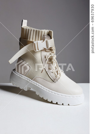 White boots in the air. fashion shoes still life 69637930