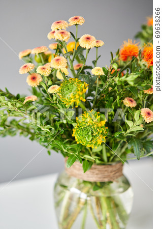 Series, step by step installation of flowers in a vase. Flowers bunch, set for home. Fresh cut flowers for decoration home. European floral shop. Delivery fresh cut flower. 69638266