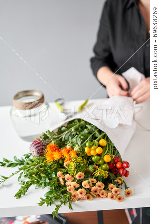 Series, step by step installation of flowers in a vase. Flowers bunch, set for home. Fresh cut flowers for decoration home. European floral shop. Delivery fresh cut flower. 69638269