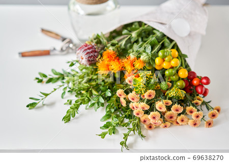 Series, step by step installation of flowers in a vase. Flowers bunch, set for home. Fresh cut flowers for decoration home. European floral shop. Delivery fresh cut flower. 69638270