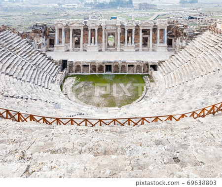 Hierapolis Theatre. Hierapolis was an ancient city built alongside hot springs in Turkey. The theatre was constructed in the 2nd century AD and the site is now a UNESCO World Heritage Site. 69638803