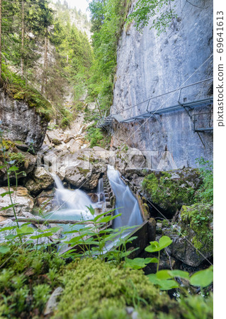The shwangau waterfalls and the Neuschwanstein The shwangau waterfalls and the Neuschwanstein 69641613