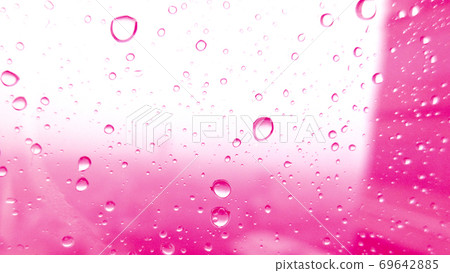 Close-up of water drops on glass surface as background Close-up of water drops on glass surface as background 69642885