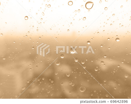Close-up of water drops on glass surface as background 69642896