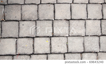 pavement Background of grey cobble stones 69643240