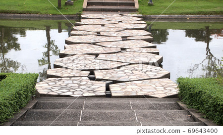 stone bridge in beautiful garden stone bridge in beautiful garden 69643400