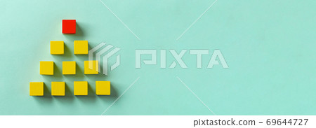 Business material. Pyramid-shaped block. Society, organization, strategy, top-down, plans, ideas, etc. 69644727