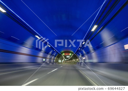 A car running through a tunnel A car running through a tunnel 69644827