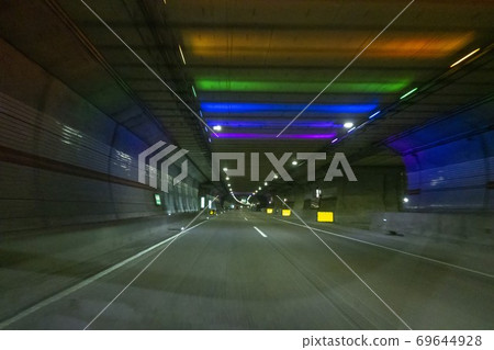 A car running through a tunnel A car running through a tunnel 69644928