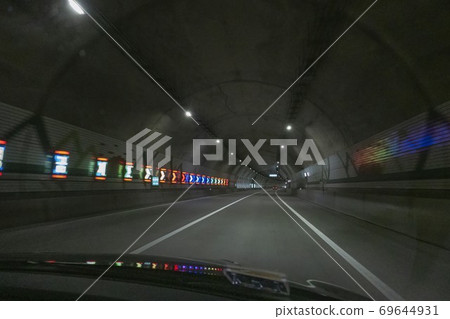 A car running through a tunnel A car running through a tunnel 69644931