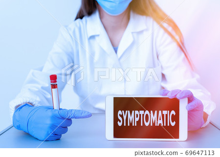 Writing note showing Symptomatic. Business photo 69647113