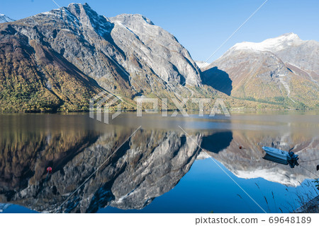 motor boat on the lake and mountains 69648189