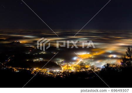 Plain illuminated partially covered by fog, soft lights 69649307