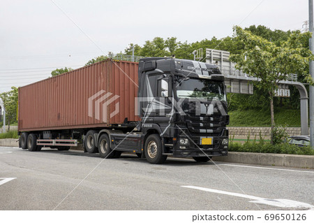A truck stopped at a highway rest area A truck stopped at a highway rest area 69650126
