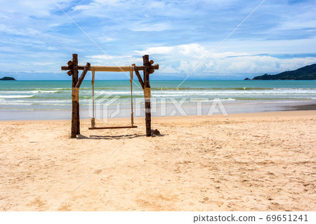 Exotic tropical paradise swings over crystal clear turquoise blue ocean sea water landscape seascape at Patong Beach, Phuket, Thailand Exotic tropical paradise swings over crystal clear turquoise blue ocean sea water landscape seascape at Patong Beach, Phuket, Thailand 69651241