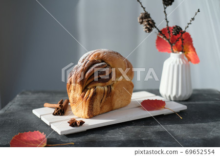 artisan sourdough cinnamon swirl bread on wooden rack 69652554