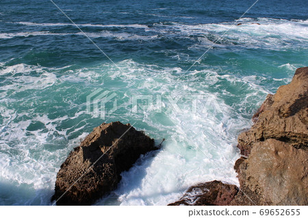 Waves hitting the rocks of the Sea of Japan Waves hitting the rocks of the Sea of Japan 69652655