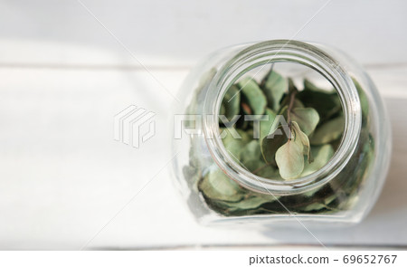 Healing herbs in glass bottle. Alternative medicine concept,  69652767