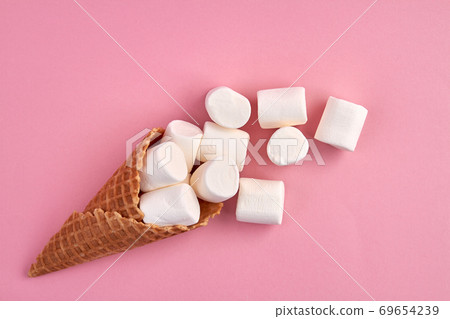 Ice-cream cone waffel with marshmallows. Ice-cream cone waffel with marshmallows. 69654239