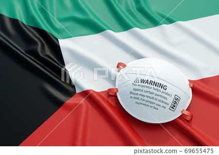 Coronavirus medical surgical face mask on the Kuwait national flag 69655475