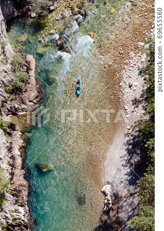 men canoeing in river 69655560