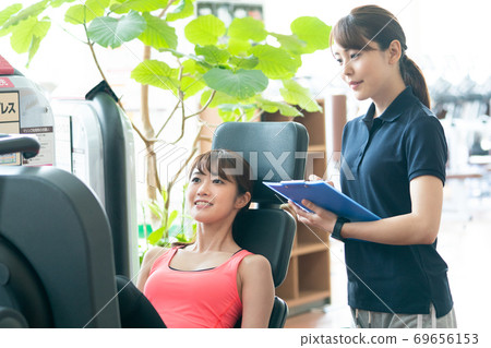 Woman training with an instructor 69656153