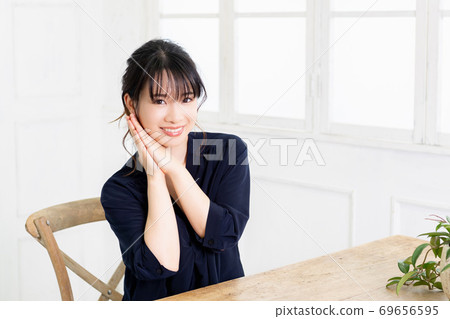Young woman making a request gesture Young woman making a request gesture 69656595
